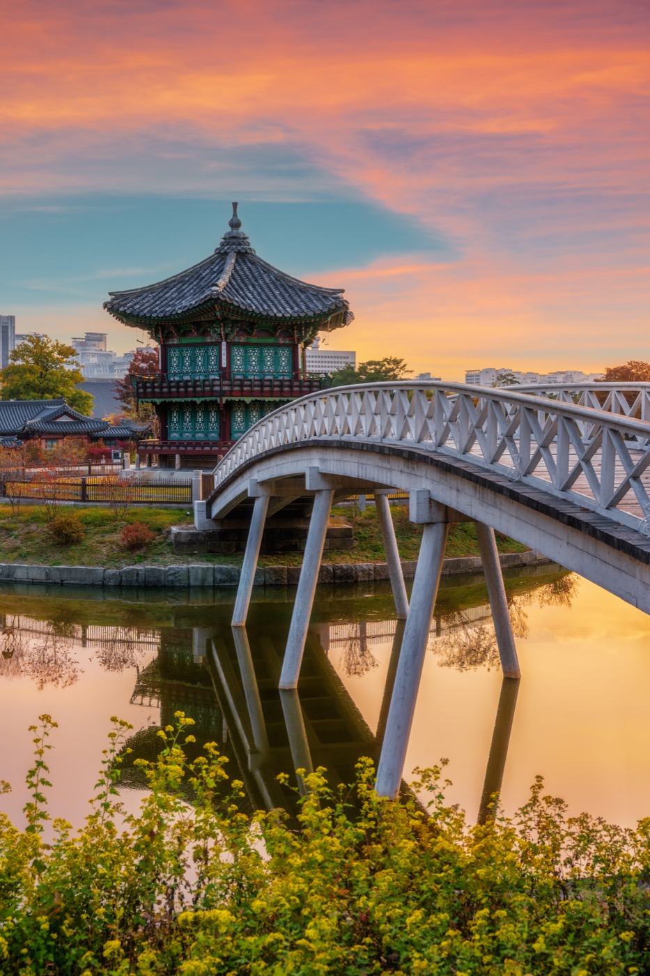 A footbridge and pavilion at sunset in Japan